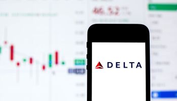 In this photo illustration a Delta Air Lines logo seen...