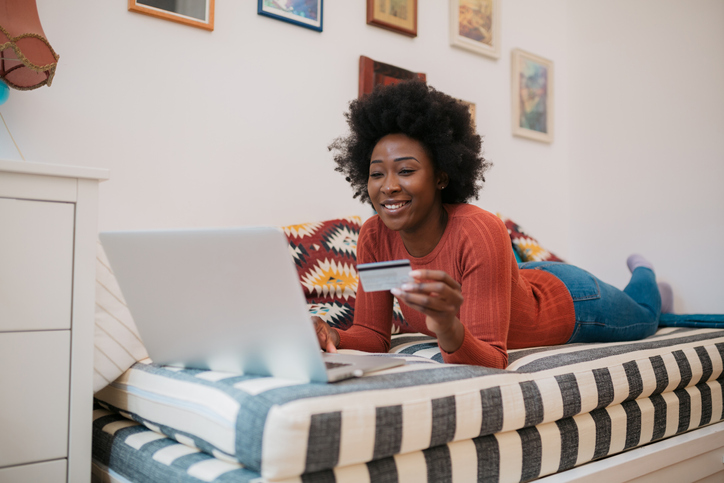 Attractive African American woman checking her bank account online