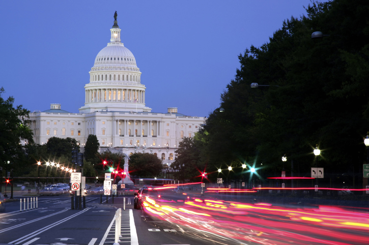 US Capitol Building and traffic tail lights on Pennsylvania Avenue.