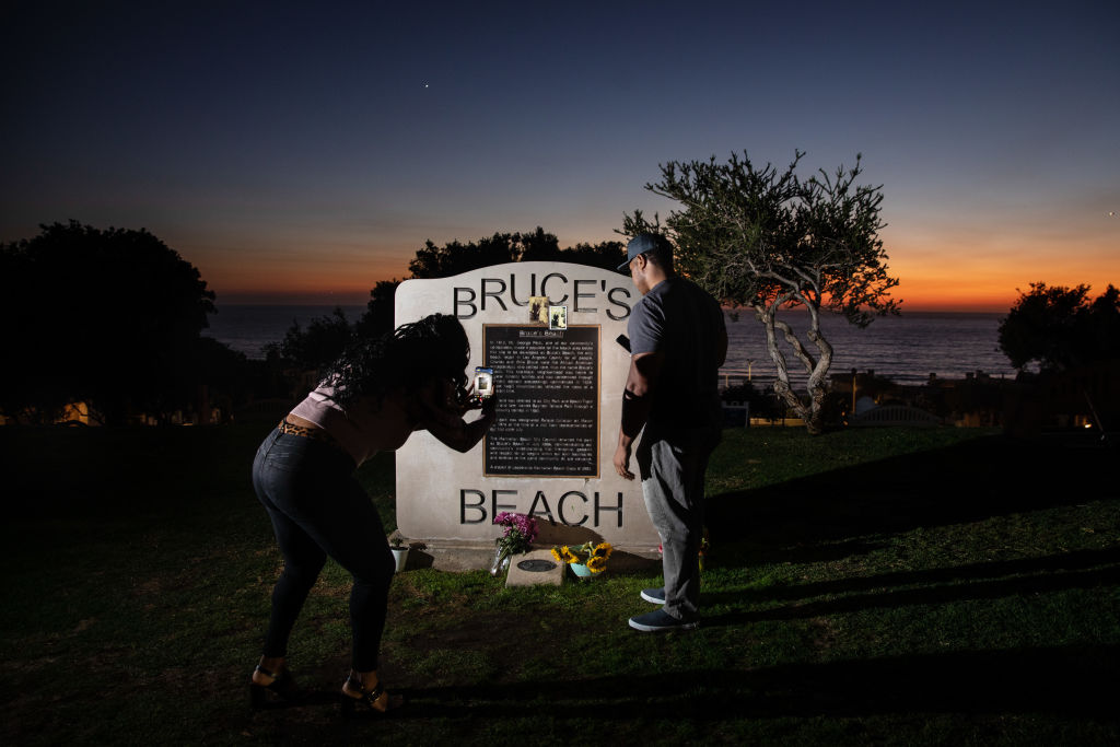 California Gov. Gavin Newsom signs SB 796 authorizing the return of beach-front land to the Bruce family, in Manhattan Beach, CA