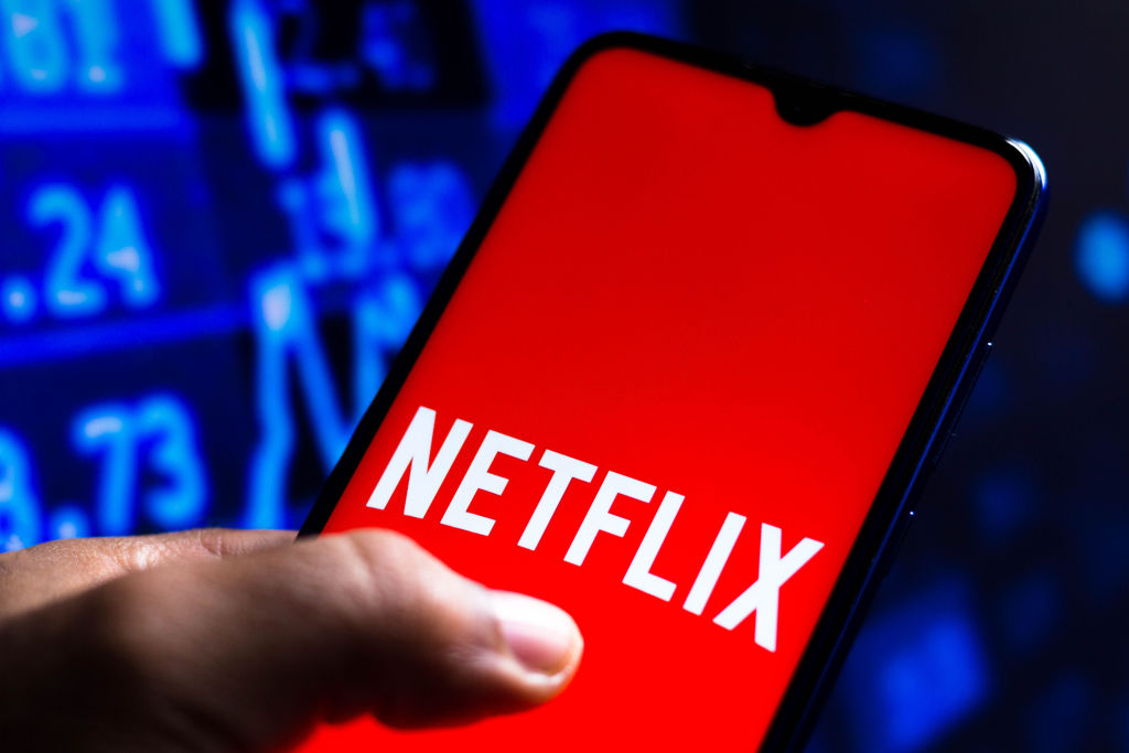In this photo illustration the Netflix logo seen displayed...