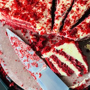 Red velvet cake slices with knife. - New Year Traditions