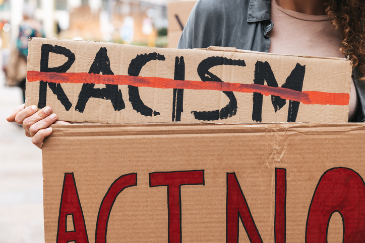 Close up on a group of activists holding their protesting messages