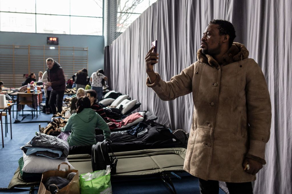 Chani, a student from Nigeria waits in a holding camp to flee Ukraine