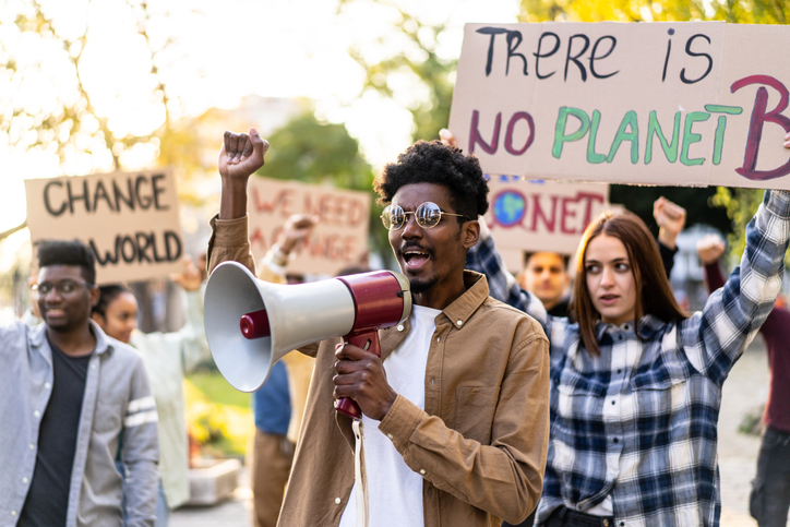 Group of demonstrators from different cultures and race fight for climate change