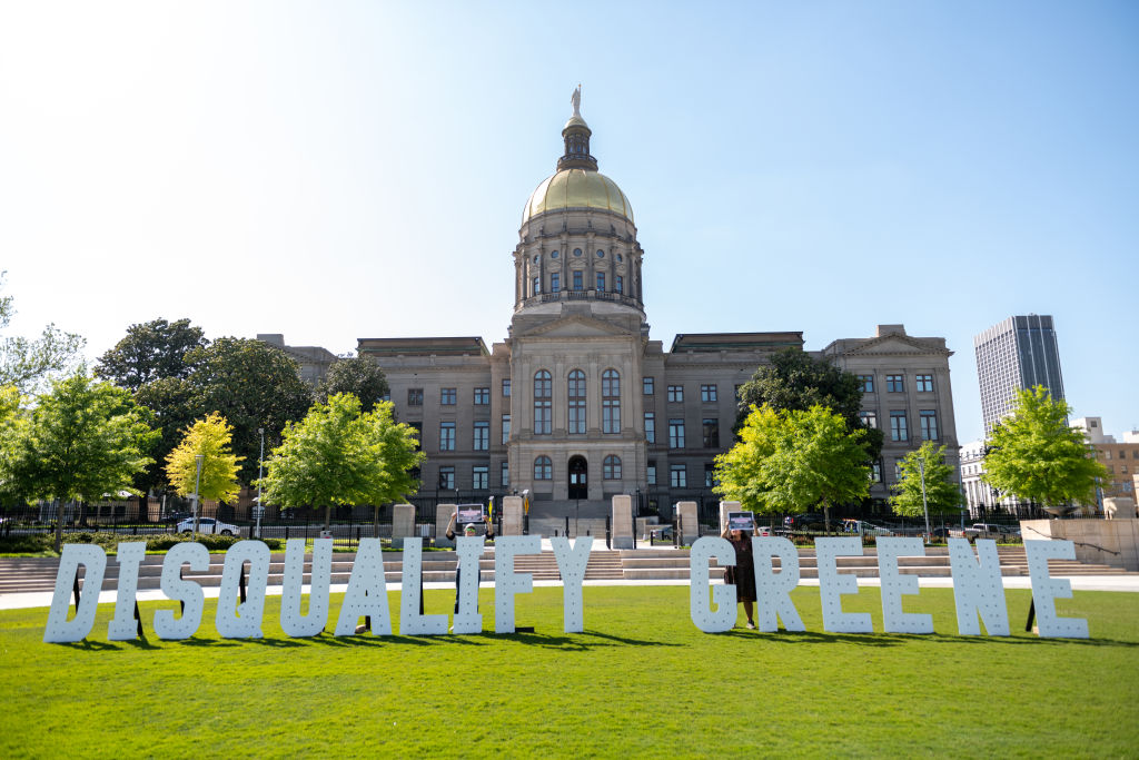 Georgians Spell Out "Disqualify Greene" In Front Of The Georgia State Capitol In Support Of The Challenge To Marjorie Taylor Greene's Qualification For The Ballot Under The Insurrection Clause Of The 14th Amendment