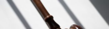 judge’s traditional wooden gavel on white background & shadow detail