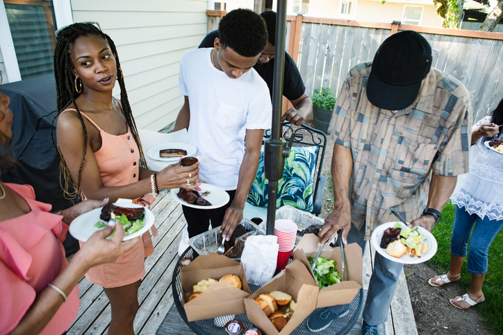 Extended Family Reuniting Together For Meal