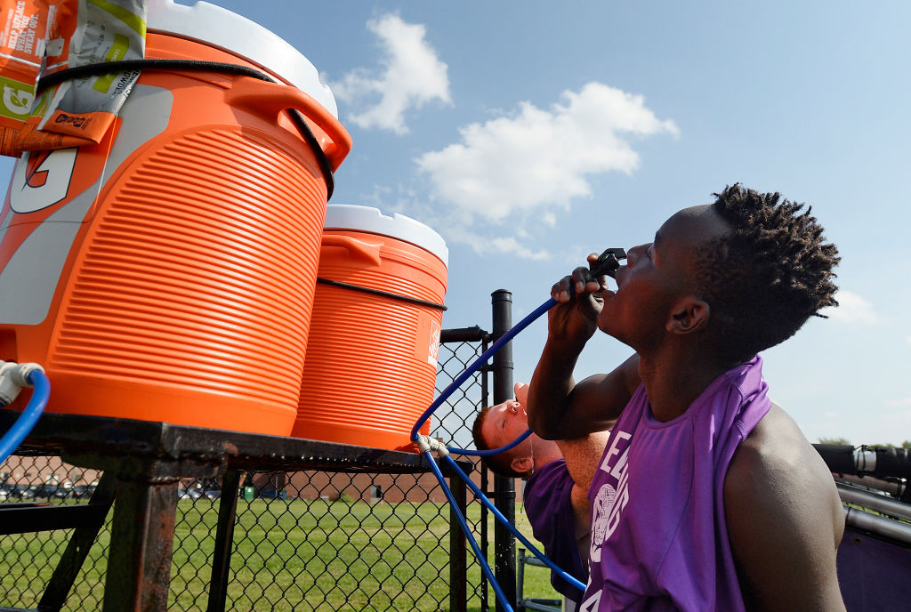 Deering High School football practices in the heat