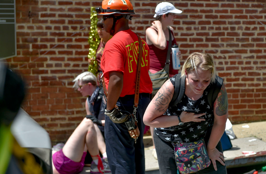 A woman appears to be injured during the State of Emergency...