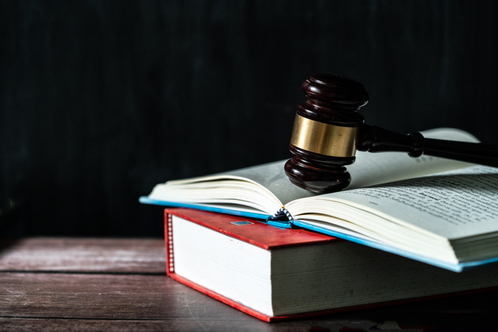 Judge gavel on legal books.