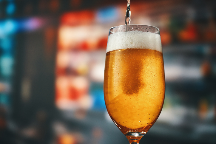 Pouring Beer into a Glass of Beer