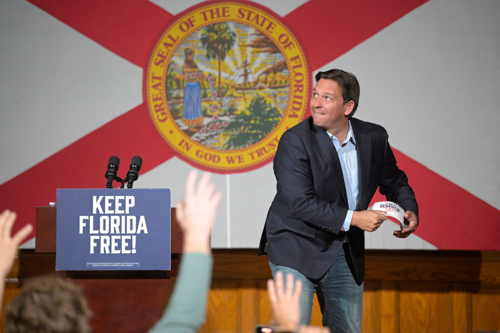 Florida Gov. Ron DeSantis throws out hat