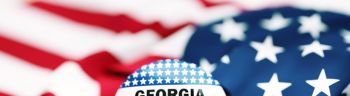 Georgia Runoff Election Dec 6 Badge Sitting Over Rippled American Flag