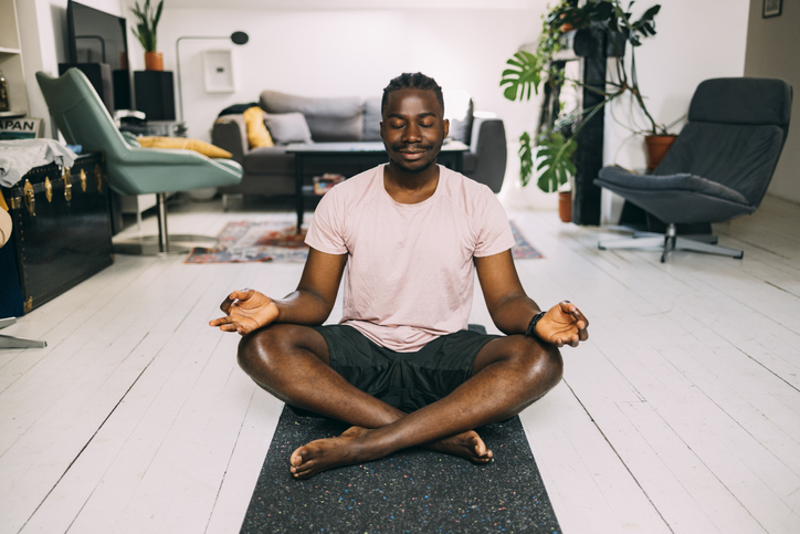 A Happy Man Doing His Daily Workout At Home