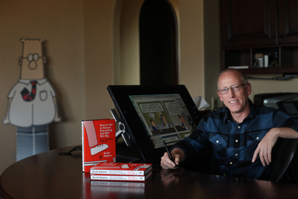 Scott Adams, cartoonist and author and creator of "Dilbert", poses for a portrait in his home office with his new book "How to Fail at Almost Everything and Still Win Big: Kind of the Story of My Life" on Monday, January 6, 2014 in Pleasanton, Calif.