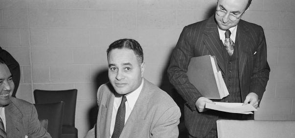 Ralph Bunche Sitting at Table