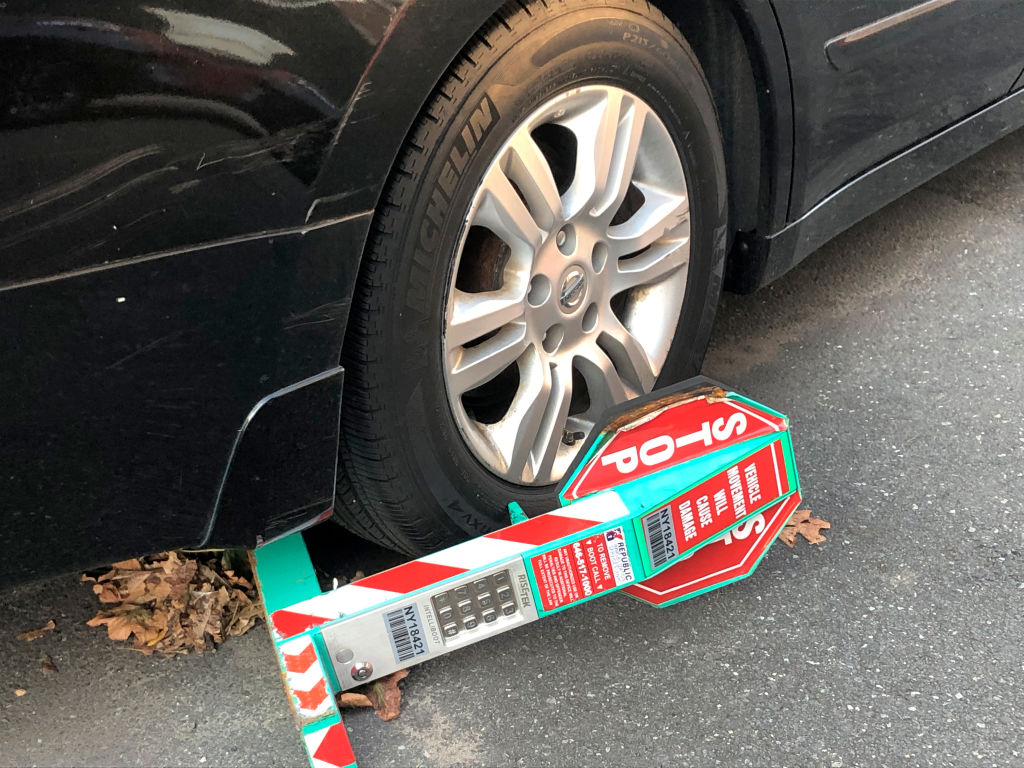 New York City car Boot on wheel, used when driver hasn't paid outstanding tickets, Queens, New York