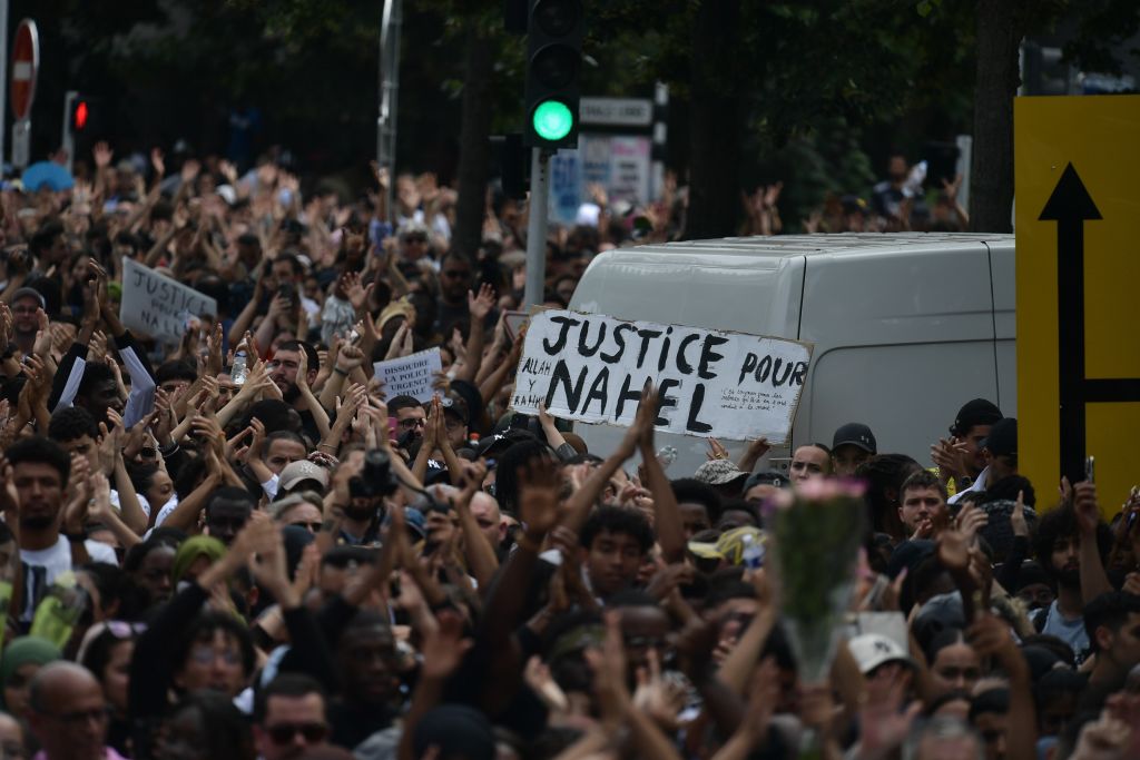 People gather to protest commemorate 17-year-old Nahel, who was shot in the chest by police in Nanterre