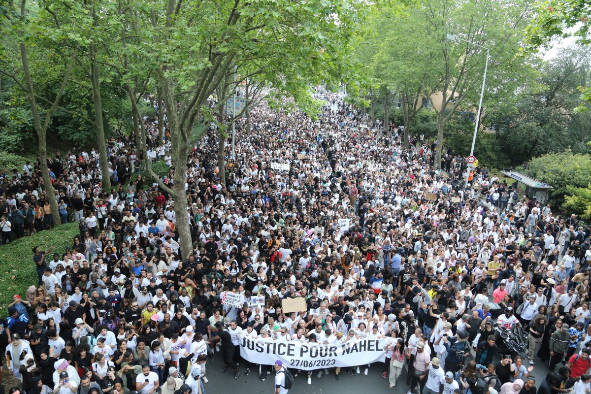 People gather to protest the death of 17-year-old Nahe