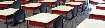 Desks and chairs in empty classroom
