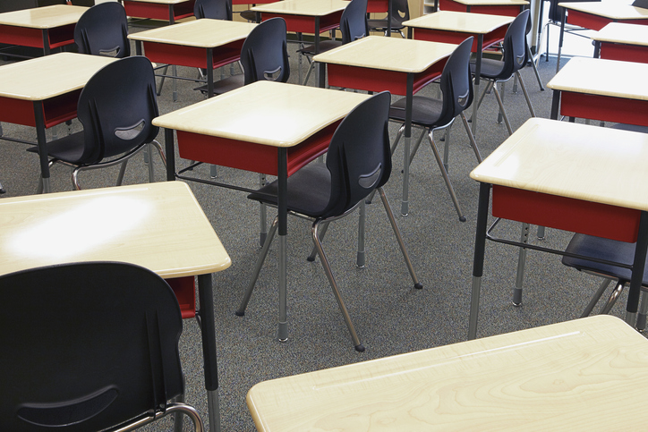 Desks and chairs in empty classroom