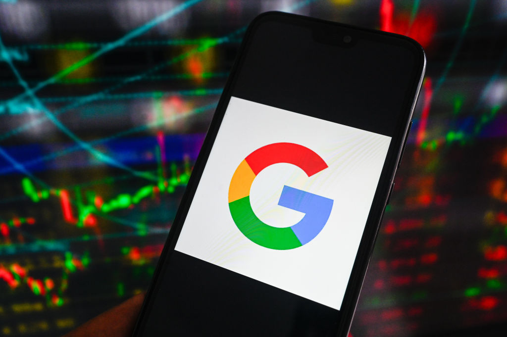 In this photo illustration, a Google logo displayed on a...