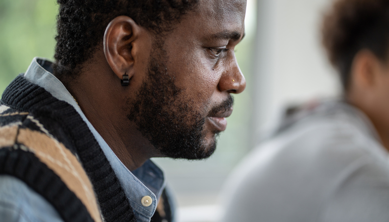Close up serious face of African American teacher in the classroom