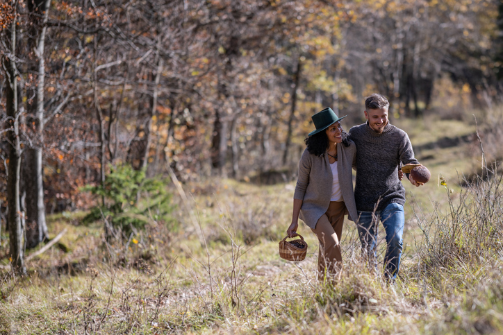 Lovers on a walk in nature in autumn.