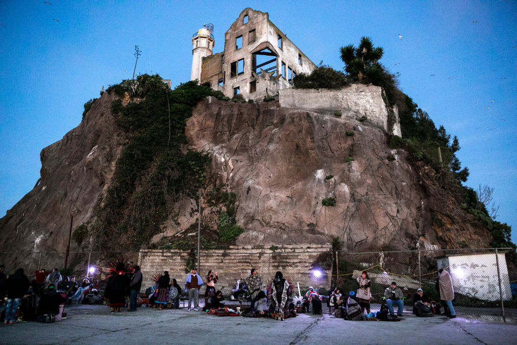 People secure their spots for the Indigenous People's Sunrise Gathering at Alcatraz Island, on Thursday, Nov. 24, 2016 in San Francisco, Calif. The gathering has been an annual tradition since 1975. Also known as Unthanksgiving Day, the event commemorates