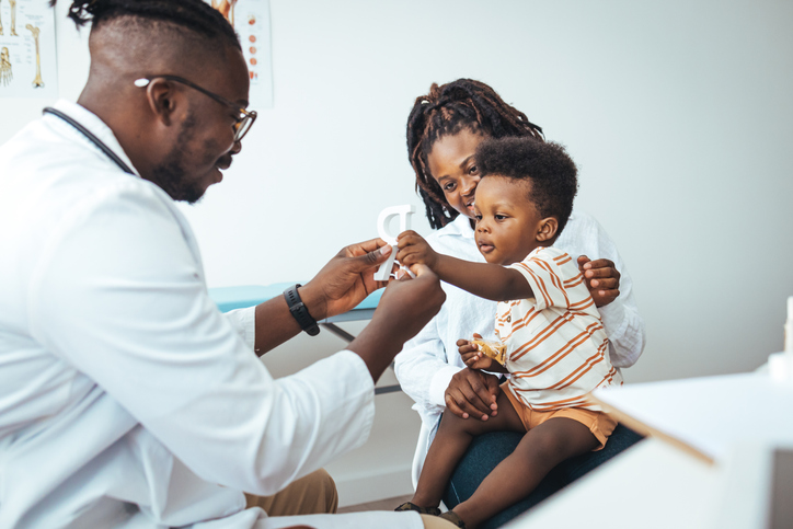 Pediatric Checkup for Young Boy with Supportive Mother