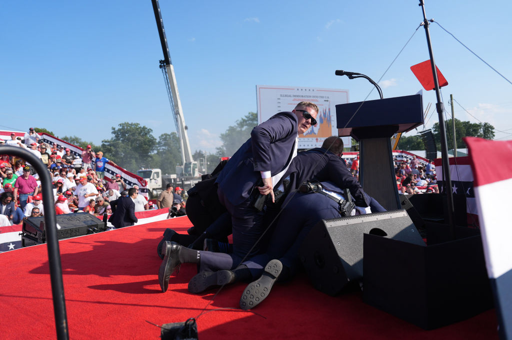 BUTLER, PENNSYLVANIA - July 13: Secret service agents cover for
