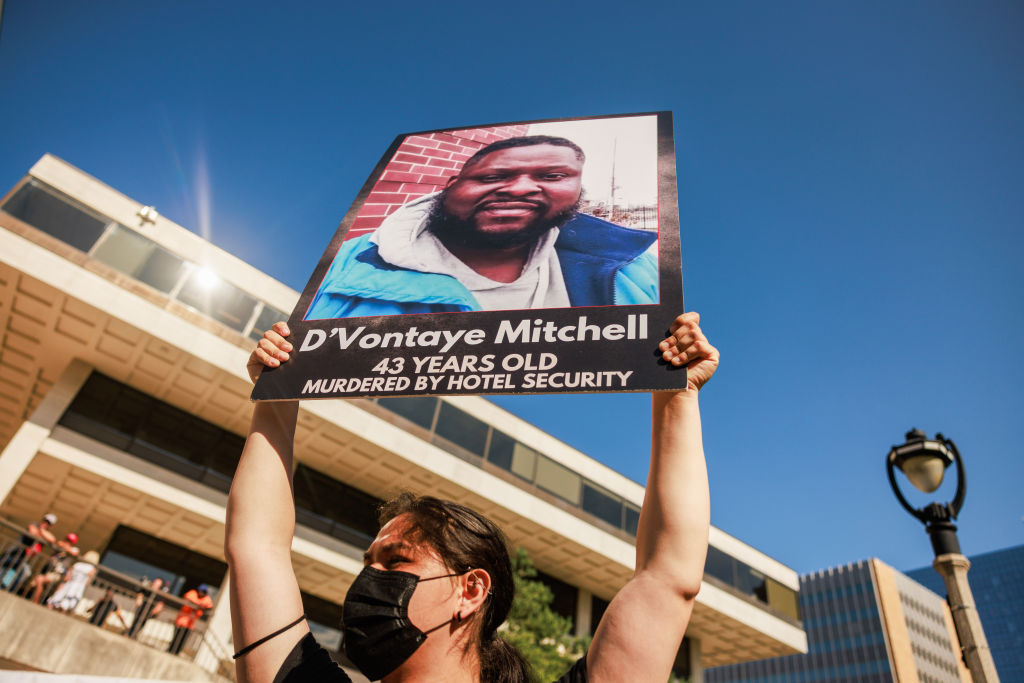 Protesters march and protest against the deaths of two Black...