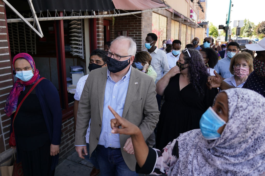 Governor Walz of Minnesota tours Lake Street, gets haircut