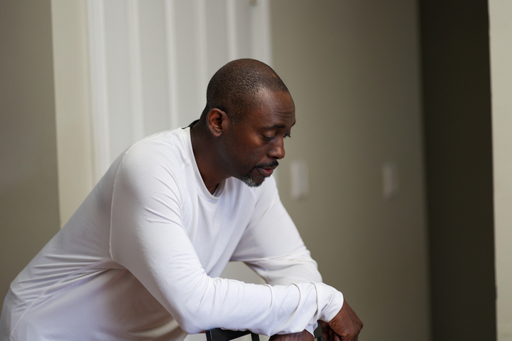 A portrait of a black man sad