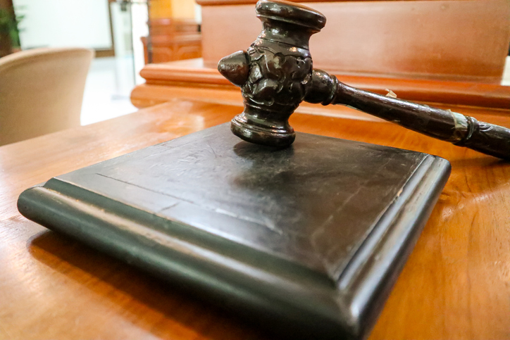 judge gavel at table in office, closeup