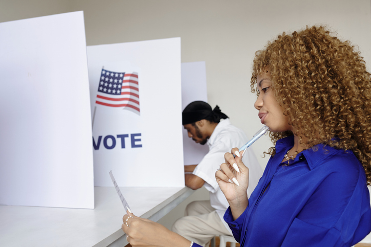 Woman Choosing Candidate To Vote