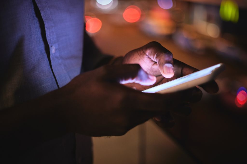 Phone, night and hands with a business man