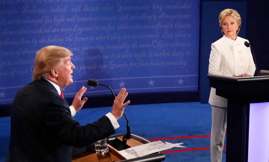 Republican nominee Donald Trump gestures as Democratic nominee Hillary Clinton