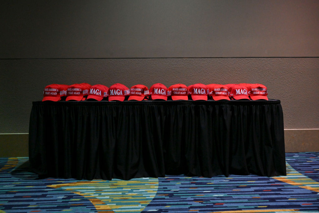 WEST PALM BEACH, FL - NOVEMBER 5: MAGA hats are placed on a tab