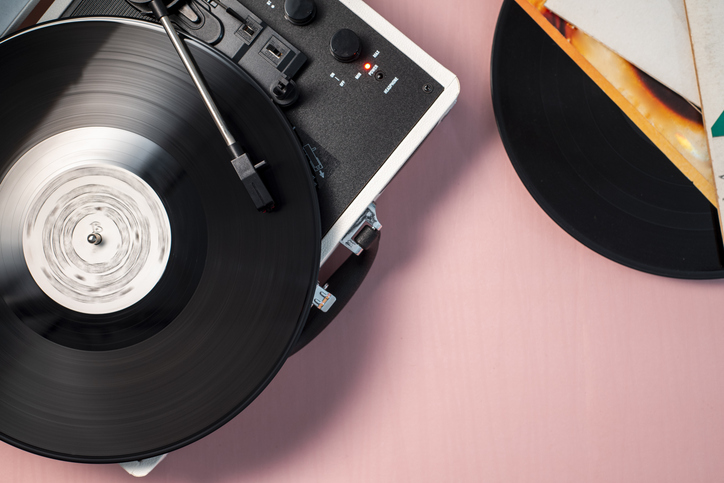 Turntable with a spinning vinyl record.