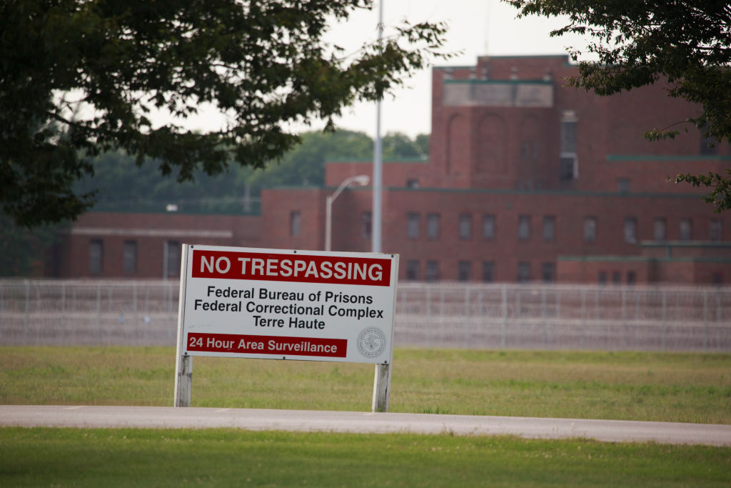 View of a sign outside the Terre Haute Federal Correctional...