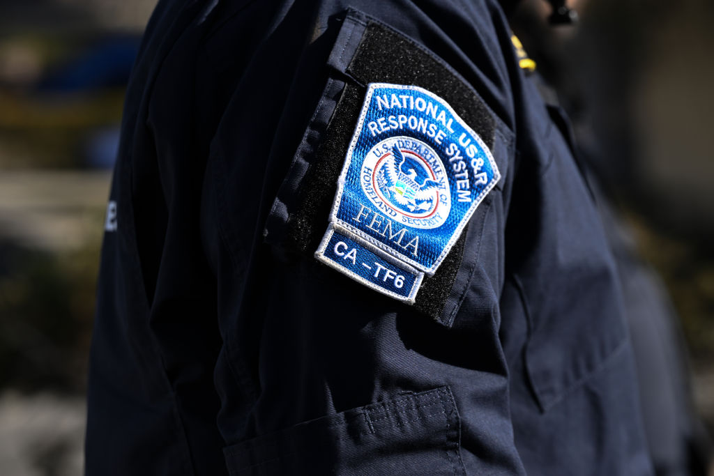 Los Angeles Fire: Search and Rescue team look for human remains in debris of burned houses