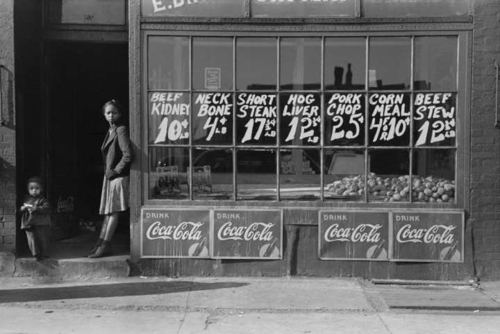 Two Children Standing in Doorway of Grocery Store, South Side, Chicago, Illinois, USA, Russell Lee, Farm Security Administration, April 1941