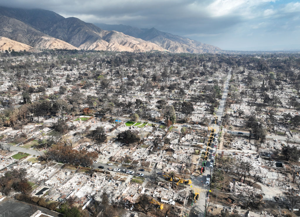 U.S Army Corps of Engineers clean up debris from the Eaton fire at a house at 119 W Palm Street in Altadena