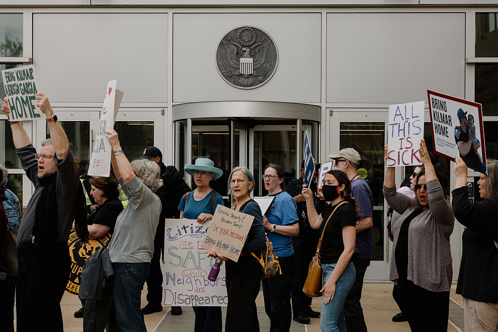 GREENBELT, MD - APR 4: Protestors stand outside the U.S. Distri