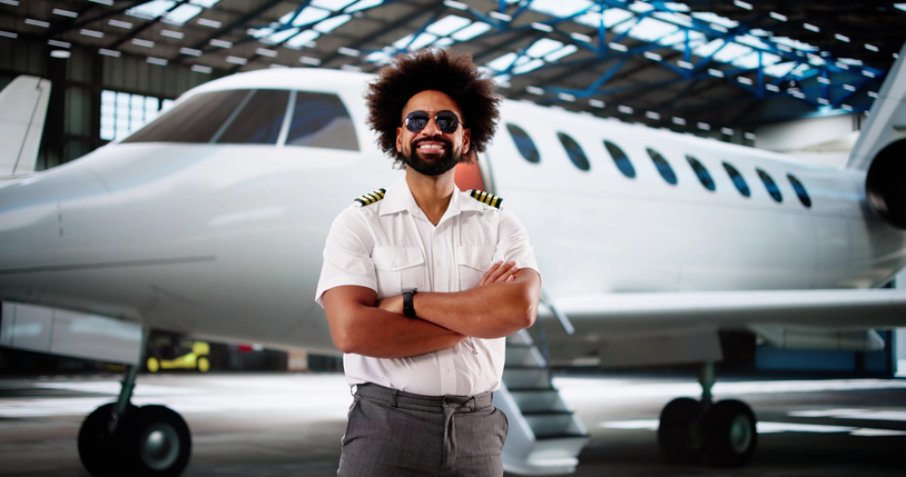 Smiling African American Airline Pilot at Airport