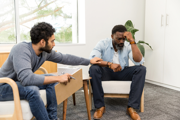 Therapist Providing Emotional Support to Male Patient, mental health 