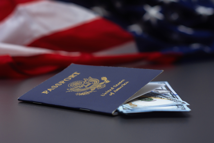 USA passport with cash and flag, symbolizing finance, travel, and citizenship United State of American.