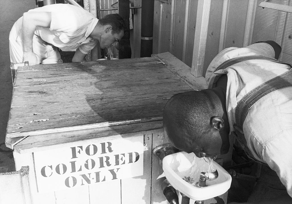 history of segregated facilities trump era - Men Drinking from Segregated Water Fountains, segregation, Black people, white people